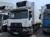 three trucks parked next to each other in a parking lot