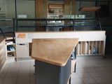 a kitchen with a table and chairs in the middle of the room