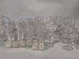 a lot of empty wine glasses sitting on a table