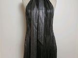 the dress is made of black leather and has a halt
