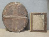 a picture of a clock and a picture frame on a table