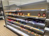 many shelves in the store with different types of food on them