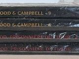 a stack of books sitting on top of a table