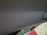 a seat belt in the back of a car with a red and white seatbelt