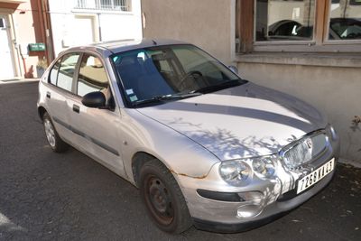 a silver car parked on the side of the street