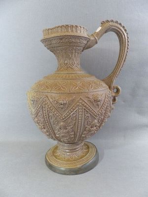 a vase that is sitting on a table with a white background