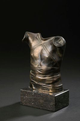 bronze bust of a female torso on a marble base