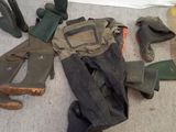 many pairs of boots and boots on the floor