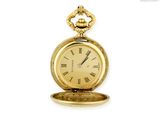 une montre de poche en or avec des chiffres romains