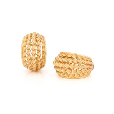 a pair of yellow gold earrings with braided design