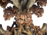 a wooden table with a marble top and a tree on it