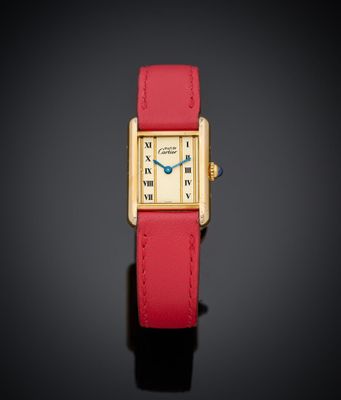 une montre-bracelet pour femme en or jaune 18 carats, avec un bracelet en cuir rouge