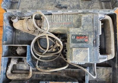 a tool box with tools in it on a wooden floor