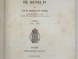 an open book with a picture of a coat of arms and a crown on it