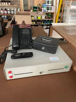 several electronic devices are sitting on top of a table in a store
