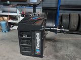 a machine that is sitting in a garage next to a wall