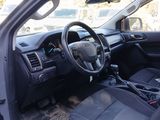 dashboard of a car with a steering wheel and dashboard controls