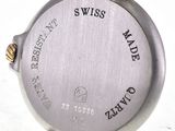 an image of a close up of a wrist watch on a white surface