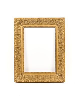 a gold frame on a white wall with a white background