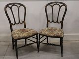 two chairs that are next to each other on the floor