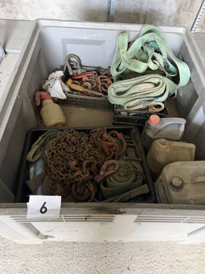 a cooler filled with assorted items sitting on the floor