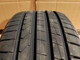 a close up of a tire on a cardboard box with a cardboard box in the background