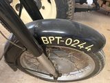 a close up of a motorcycle with a tire on the ground