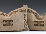 pair of two decorative pillows with embroidered monograms on them