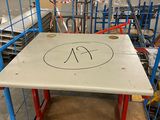 a table that has a number on it in a warehouse