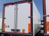two trucks that are parked next to each other in the parking lot
