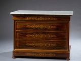 a small chest of drawers with a marble top