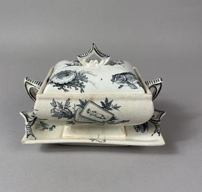 an antique blue and white tureeny dish with a lid