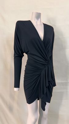the dress is black and has long sleeves and a v - neck