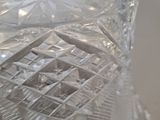 a clear glass vase with a decorative design on it