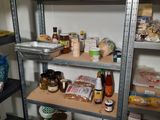 a shelf of food and condiments in a kitchen