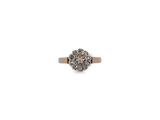 a close up of a diamond ring on a white background