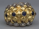 an image of a gold ring with sapphires and diamonds