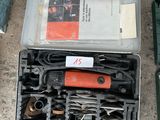 many tools in a case on the ground