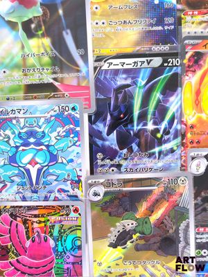 several pokemon cards are displayed on a table in a room