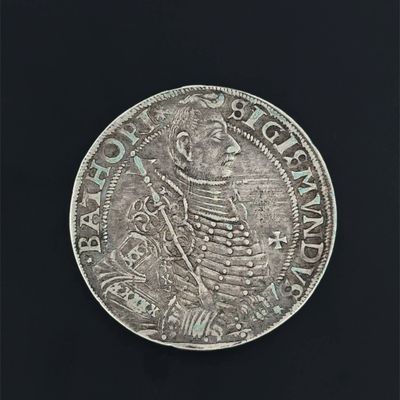 a silver coin with an image of a man on it