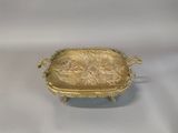 gold plate with a picture of a man and a woman on it