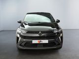 the front view of a black suv parked in a white room