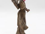 figurine of a woman with a top hat holding a bird