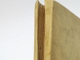 a book with a bookmark sticking out of it ' s cover