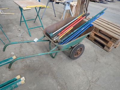 a wheelbarrow with a lot of tools in it