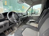 a view of the inside of a van with the driver ' s seat up