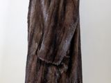 an image of a fur coat on a mannequin stand