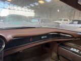 a dashboard of a car in a car showroom