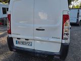 a white van that is parked in a parking lot