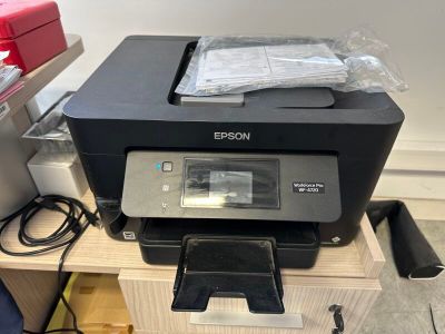 a printer that is sitting on top of a table
